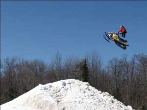 Snowmobiler on Jump