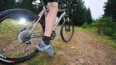 Close up of mountain biker about to hit the trail