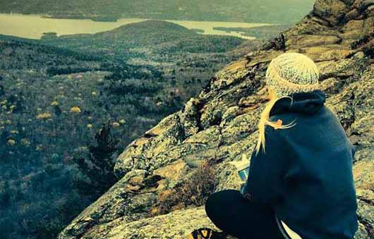 girl sitting on summit