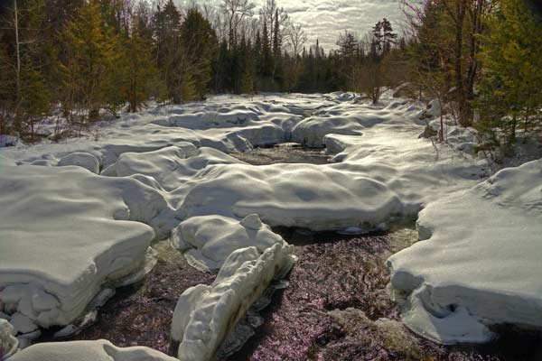 Snow lined creek