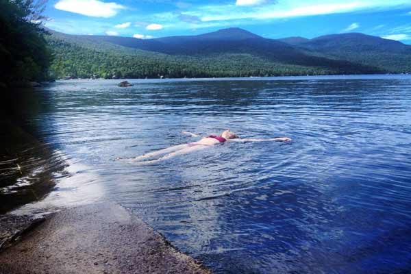 woman floating in a lake