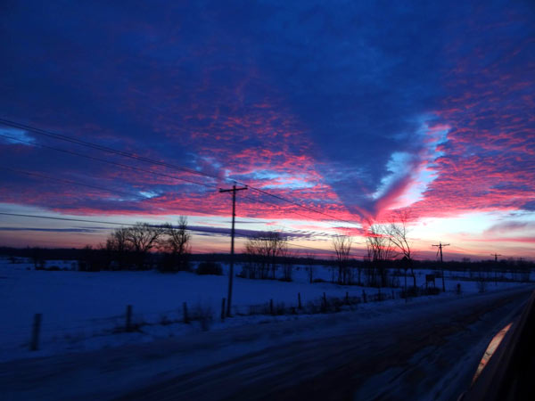 sunset along a country road in winter