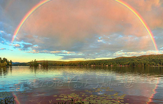 rainbow reflecting on the water