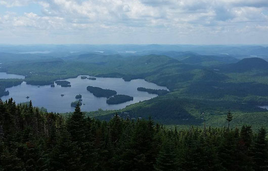 summit overlooking blue mountain lake