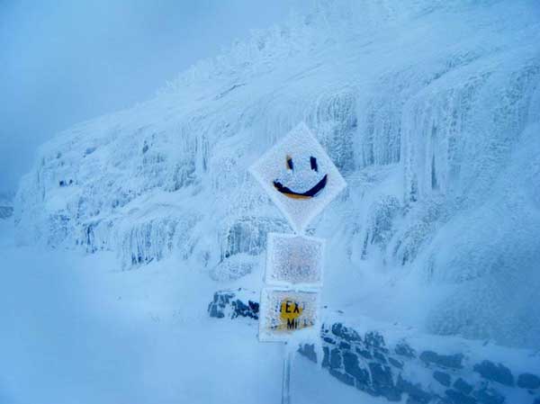 icy road signs along whiteface mountain