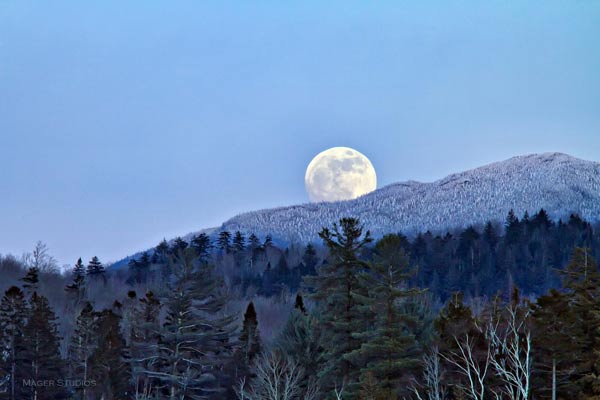 Wolf moon rising over Adirondack mountains