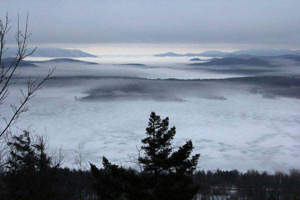 Fog and clouds shrouding hills and peaks