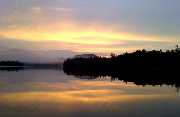 Fog over Blue Mountain Lake at sunrise