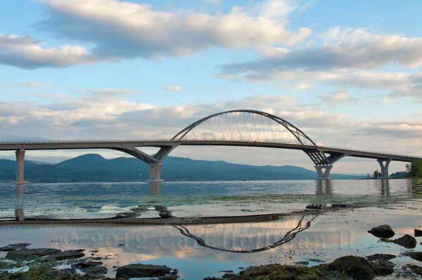 bridge over lake champlain reflecting on the water