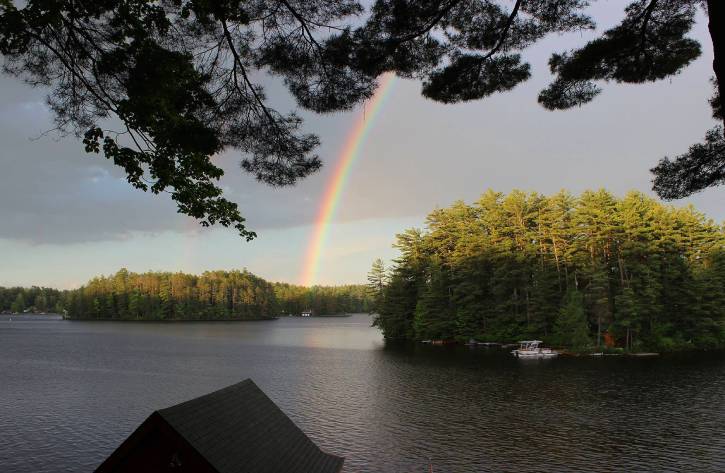 Rainbow over a lake in the summer