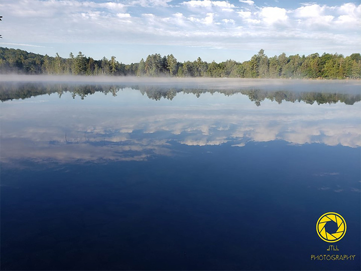 mist on a lake in the morning