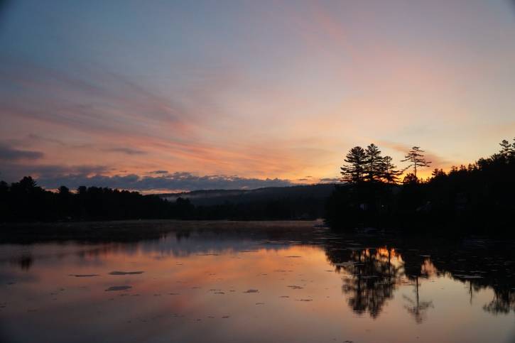 Orange and blue sunrise over a lake