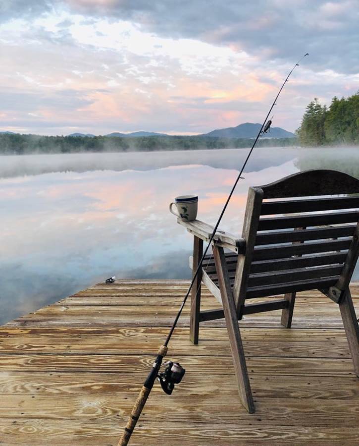 chair on dock overlooking sunrise