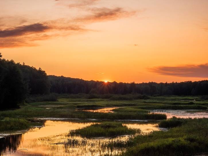 Orange sunset over a river