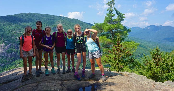 seven campers on a mountain summit