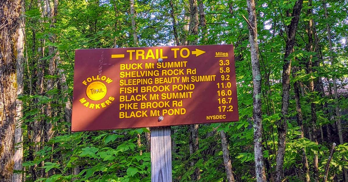 trailhead sign to multiple trails