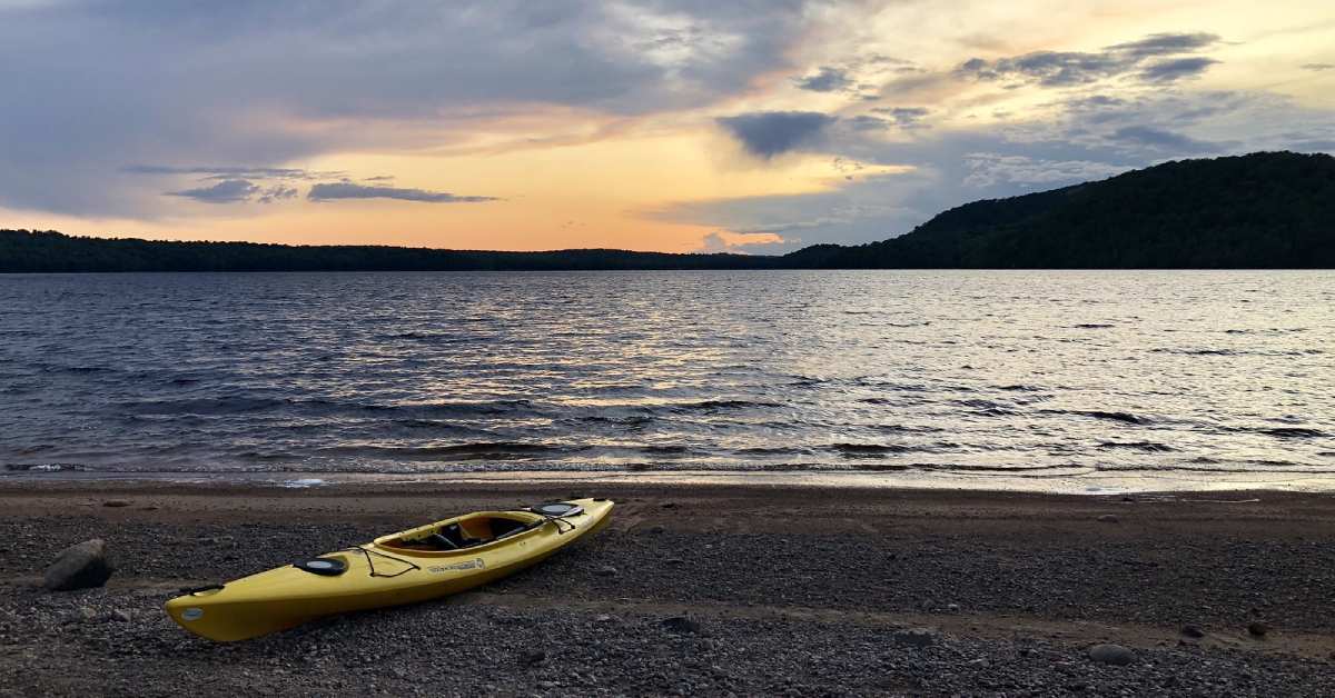 a kayak on the shore of carry falls reservior