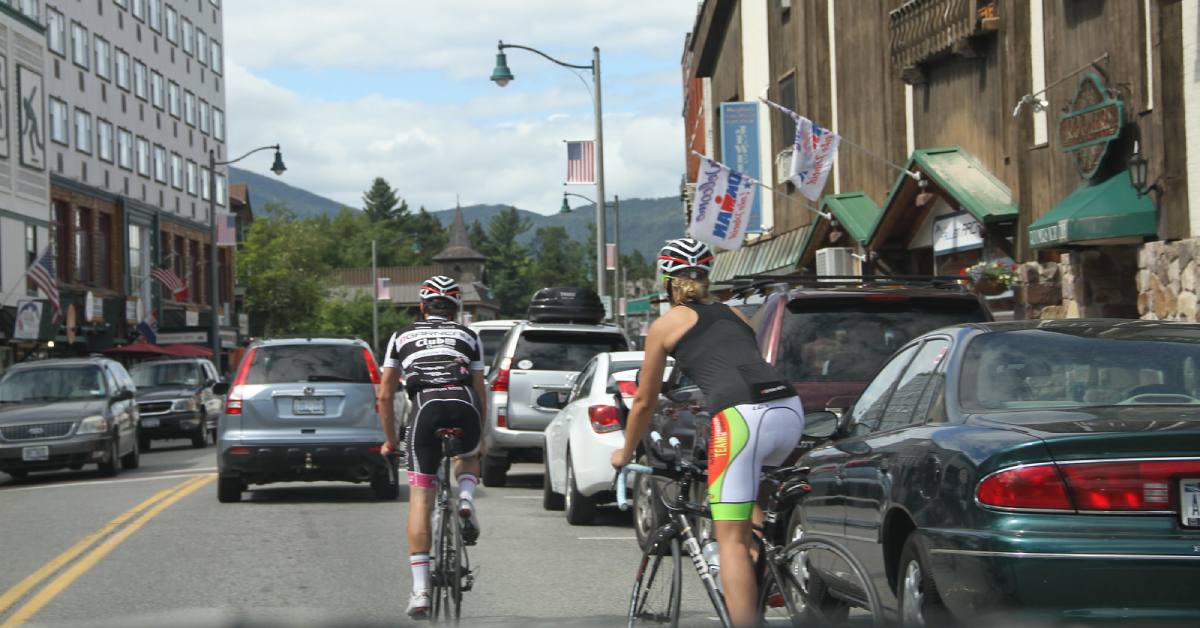 cyclists riding alongside traffic in lake placid