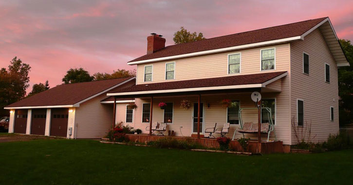 a bed and breakfast at sunset