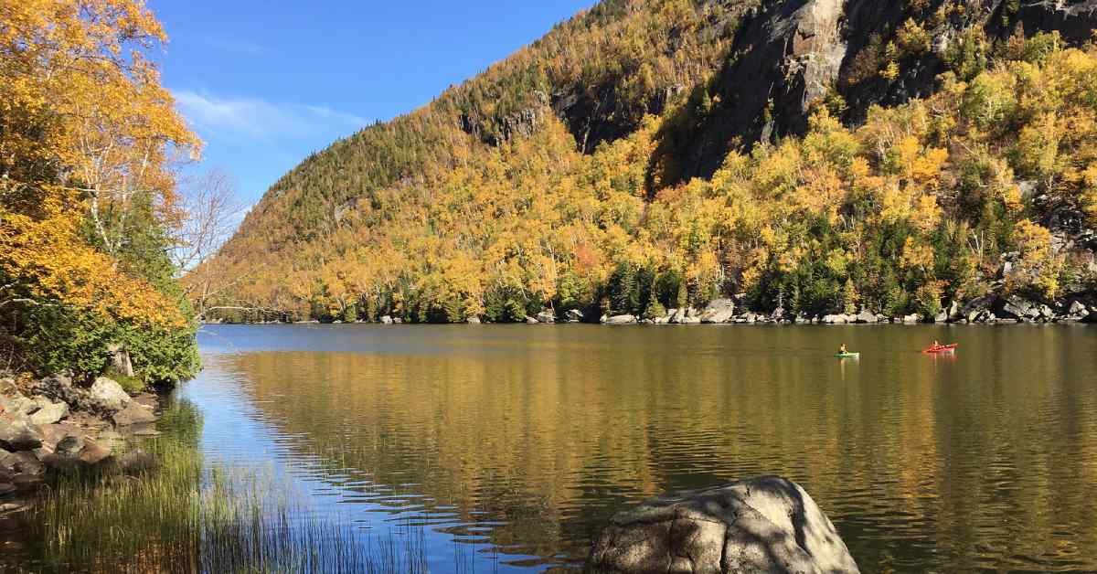 kayakers on a river in the adirondacks