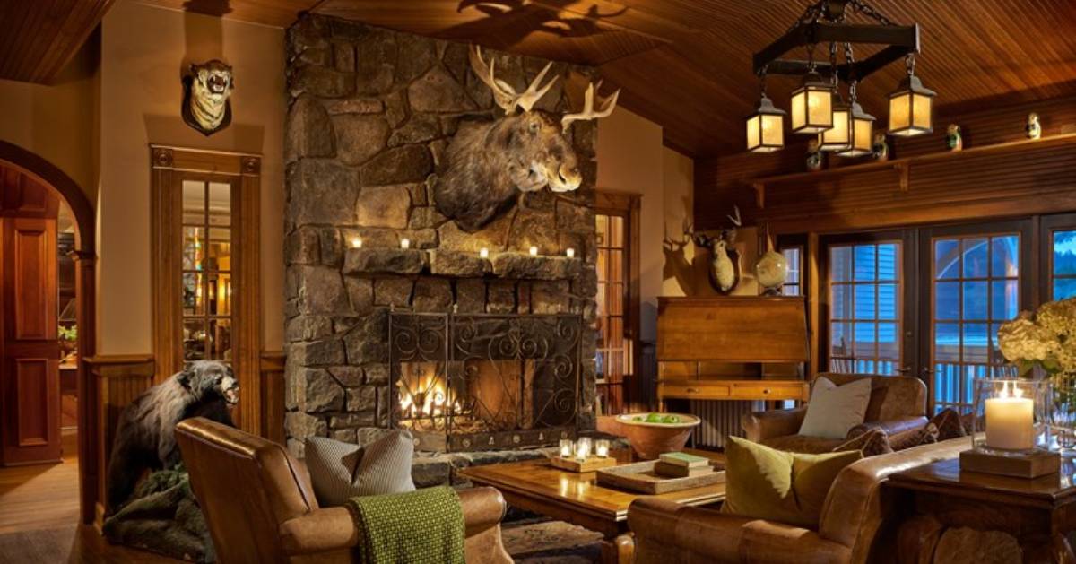 rustic Adironadck room with moose head over fireplace