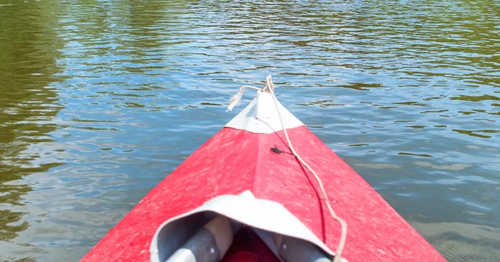 front of red kayak