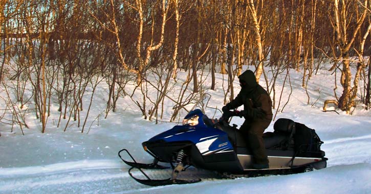 a lone snowmobile rider