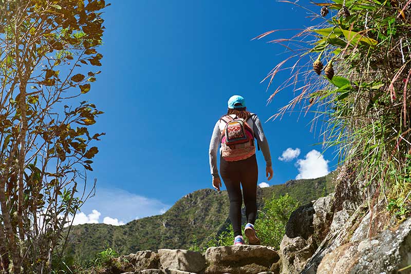 solo hiker up a mountain