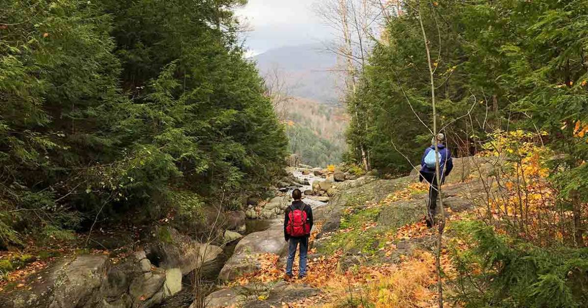 two people hiking in the fall