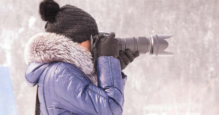 woman holding a camera