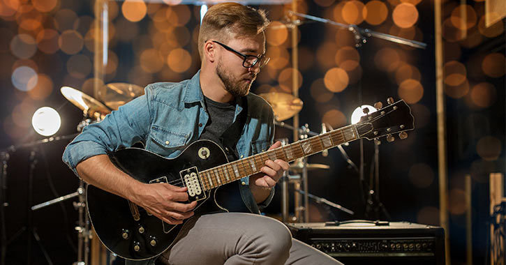 guitarist on stage with equipment