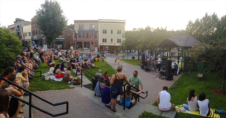 a crowd enjoys a summer concert at berkeley green