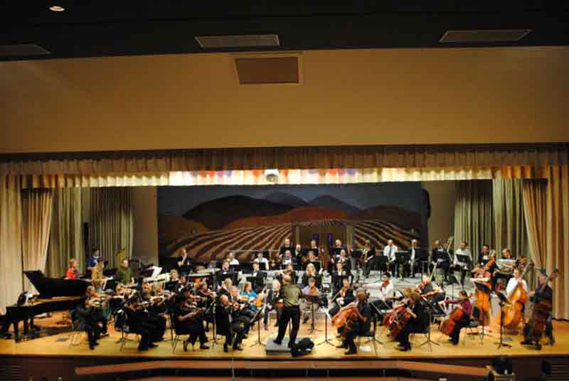 The Orchestra Of Northern New York Plays On Stage In A Rehearsal